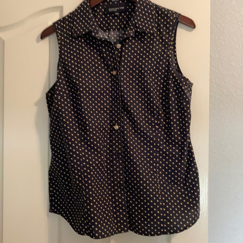 Navy and tan polka dotted sleeveless shirt